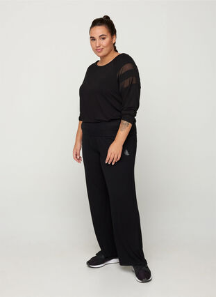 Flared sports trousers made from a viscose mix, Black, Model image number 1