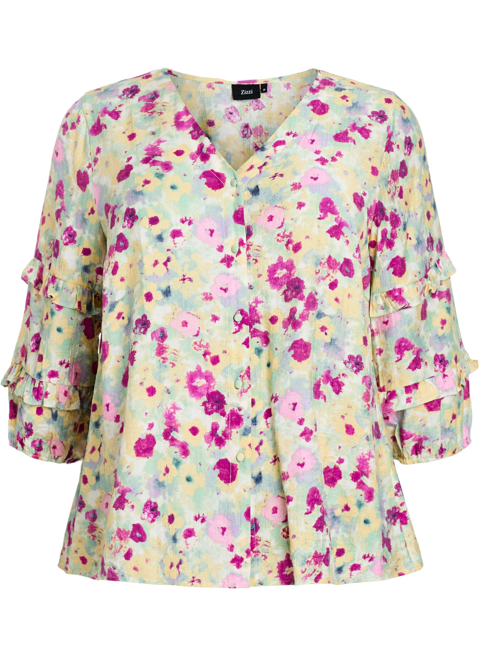 Blouse with ruffle details and floral print