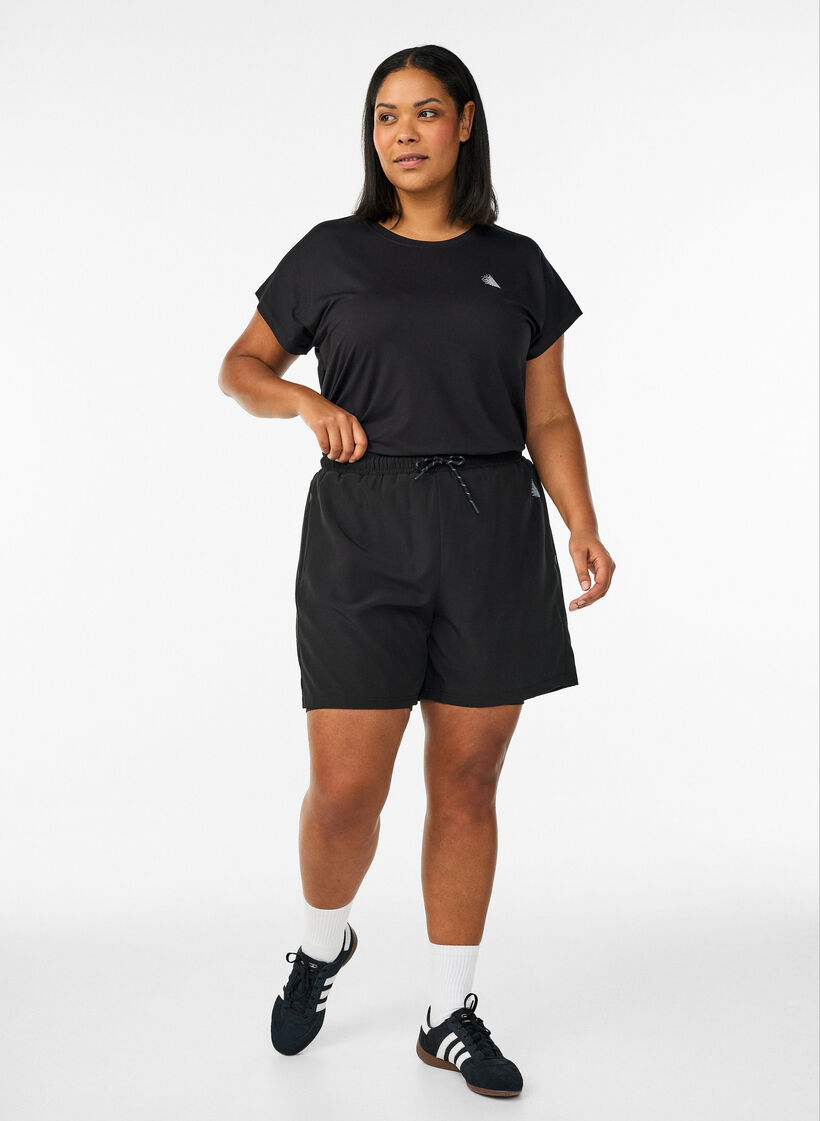 Training shorts with inner shorts and a phone pocket, Black, Model image number 1