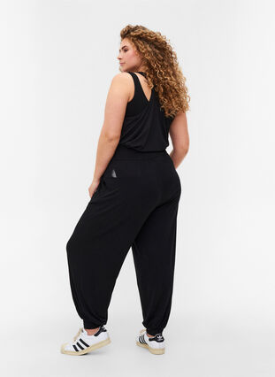 Loose exercise trousers in viscose with pockets, Black, Model image number 1