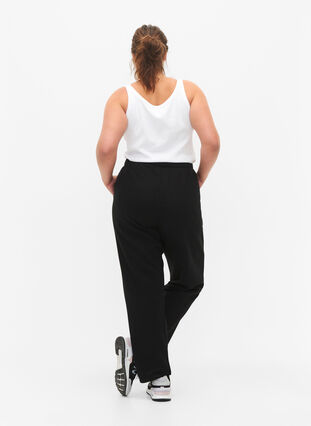 Loose cotton trousers with pockets, Black, Model image number 1