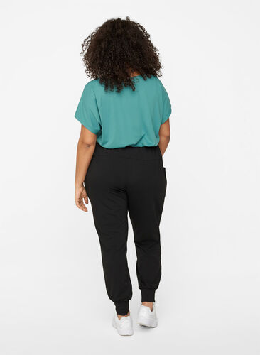 Loose trousers with pockets, Black, Model image number 1