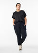 Loose workout trousers with pockets, Black, Model image number 1